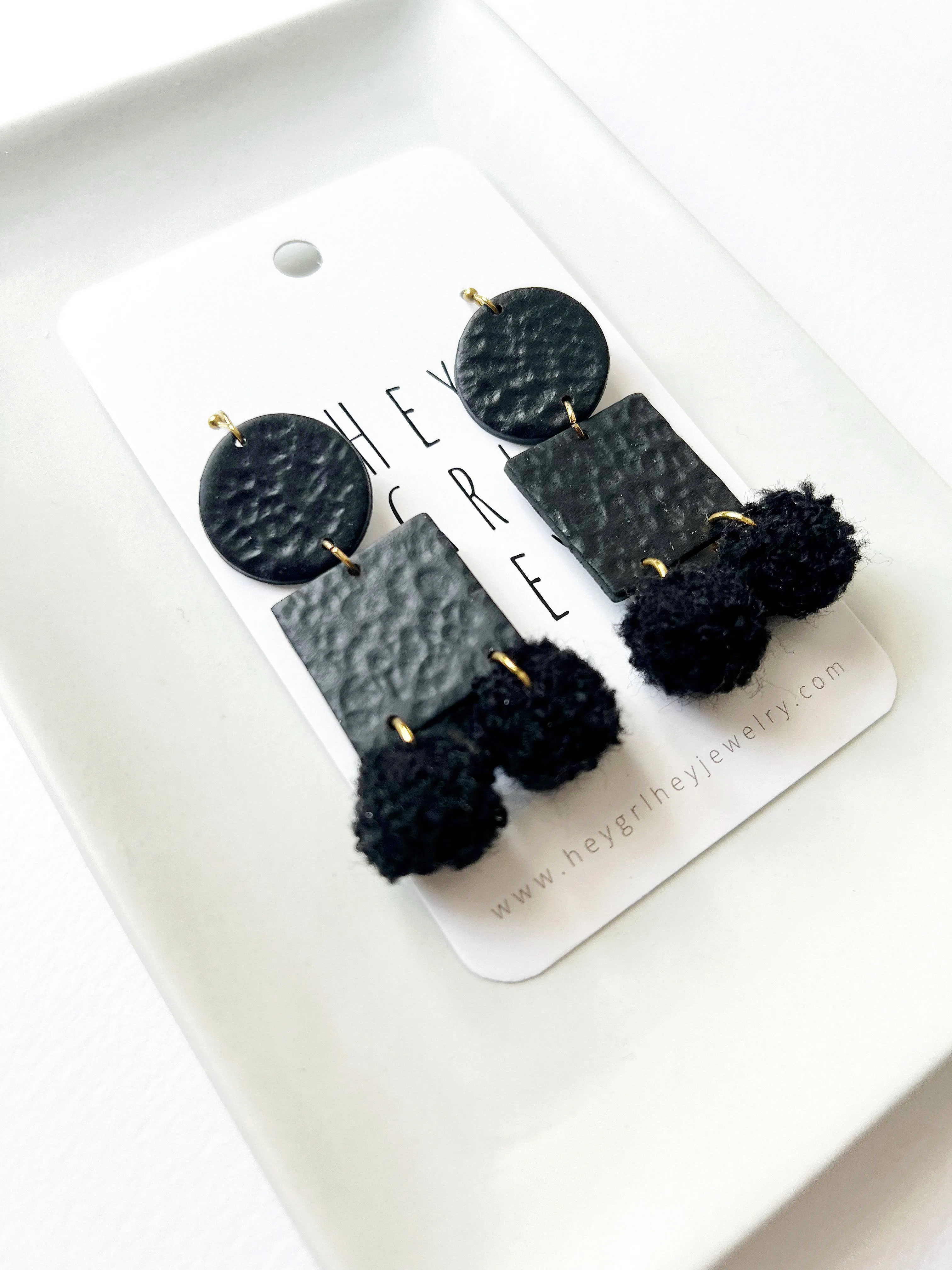 The Black Pom Pom Earrings