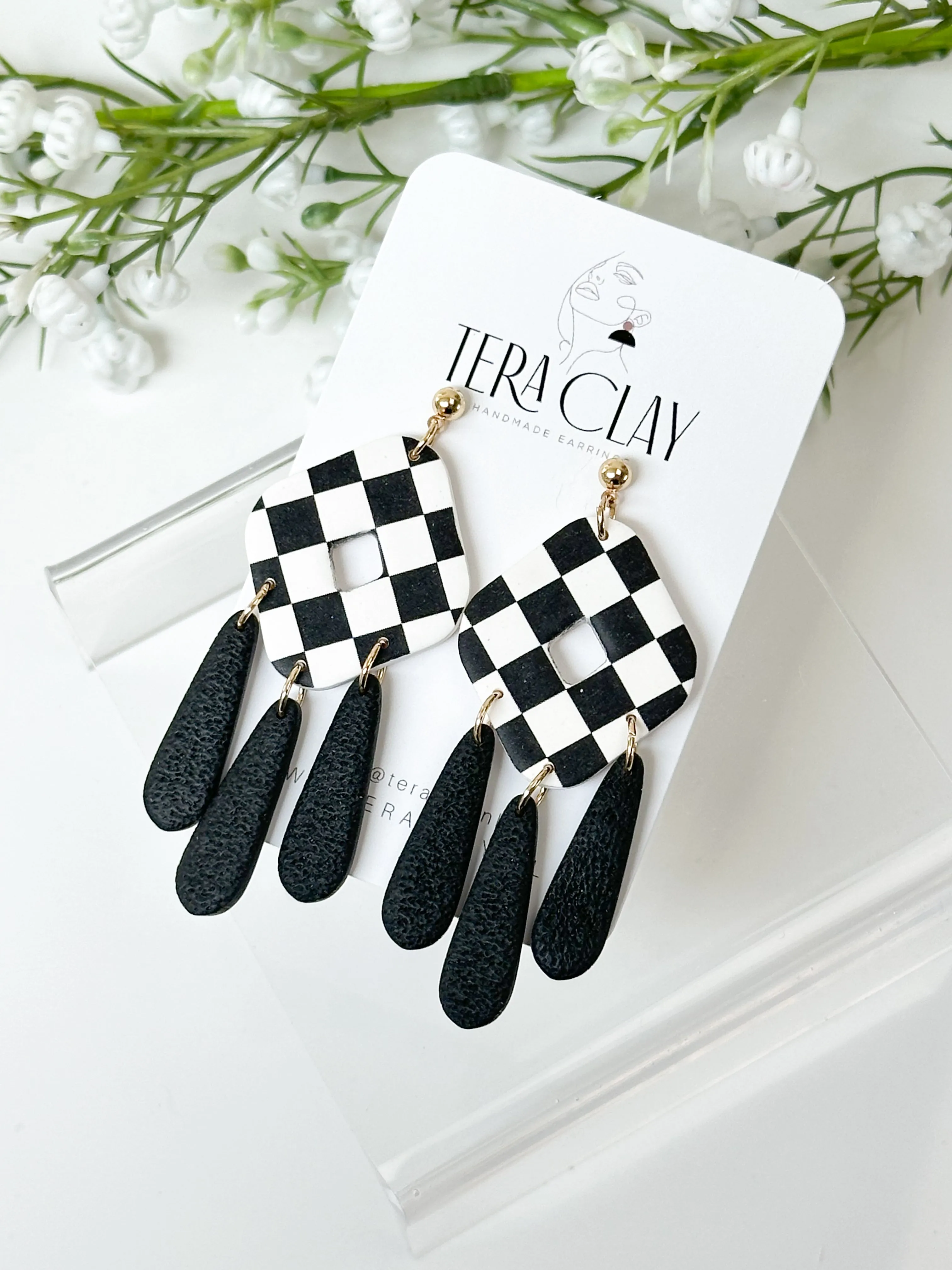 The Checkered Rhombus Dangles